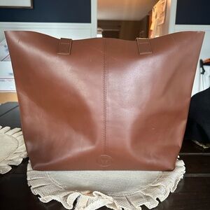 Le Papillion large brown tote bag.